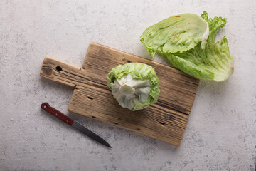 Wall Mural - White cabbage for salad on a cutting board, close up