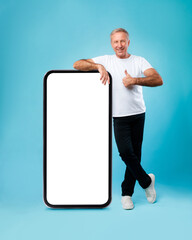 Poster - Happy adult man showing white empty smartphone screen and like