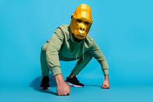 Photo Of Incognito Intimidating Guy Sit Fists Squat Wear Gorilla Mask Sportswear Isolated Blue Color Background