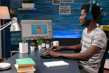 Poster - african american man editor with headphones doing photo retouch on computer using creativity post pr