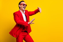 Photo Of Smiling Positive Guy Dancing Fooling Around Wear Well-dressed Formalwear Suit Isolated On Yellow Color Background