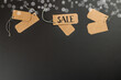 Black Friday. Sale tags on the black background. Zero waste shopping concept