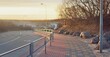 An empty bicycle road and pedestrian walkway (promenade) to the Baltic sea coast at sunset. Ventspils, Latvia. Leisure activity, sport, recreation, nordic walking, transportation, lifestyles theme