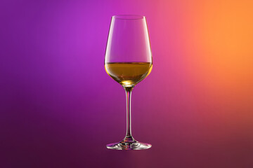 Wall Mural - White wine glass isolated over gradient purple and orange color background in neon. Concept of alcohol, holidays, New Year