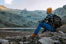 Man Sitting Enjoying The Mountain Scenery