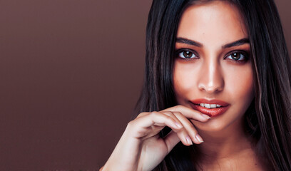 Wall Mural - cute happy young indian woman in studio close up smiling, fashion beauty