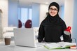 © BillionPhotos.com - Arab at work. Emirati woman using computer typing. Girl in Abaya and Hijab