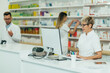 © Zamrznuti tonovi - Senior female pharmacist working in a pharmacy