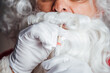 Santa spitting salty water into container as part of PCR test