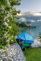 typical swiss village on blue lake at sunrise