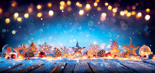 Wall Mural - christmas decoration on wooden table in blue abstract defocused backdrop