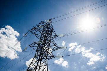 High voltage tower with sky background.