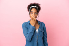 Young Latin Woman Isolated On Pink Background Covering Mouth With Hand