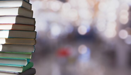 Poster - Stack of books in the colored cover lay on the table . Education learning concept