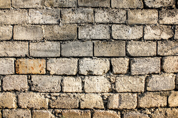 Wall Mural - Unfinished brick wall background. Rough brick wall texture.