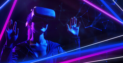 Wall Mural - Metaverse virtual event future game entertainment digital technology . Teenager having fun play VR virtual reality glasses sport game metaverse NFT game 3D cyber space futuristic neon background.