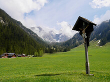 Traditional Mountain Huts And Wayside Cross In Nenzinger Himmel In Early Spring. Vorarlberg, Austria.
