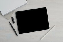Empty Black Screen Tablet Mockup For Design Or Text Presentation, Workspace With Notebook, Gel Pen And Pencil, Planning, Blog, Online Learning Concept.