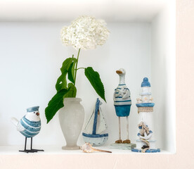 Wall Mural - Still life with wooden toys on a marine theme and blooming hydrangea.