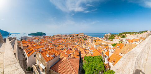 Wall Mural - Aerial panoramic view of old city Dubrovnik. Ancient city with big city walls near adriatic sea. View of roofs, sunny summer day.