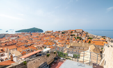 Wall Mural - Aerial panoramic view of old city Dubrovnik. Ancient city with big city walls near adriatic sea. View of roofs, sunny summer day.