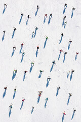 Ski resort. Aerial view of skiers and snowboarders. Winter sports.