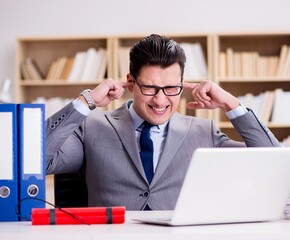 Wall Mural - Businessman with dynamite in the office