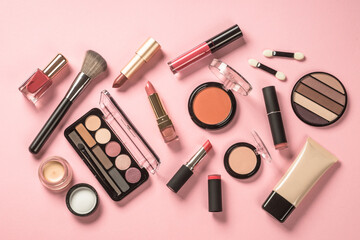 Fototapete - Make up products at pink background. Eye shadow, powder, cream, lipstick and more for professional make up. Flat lay image with copy space.