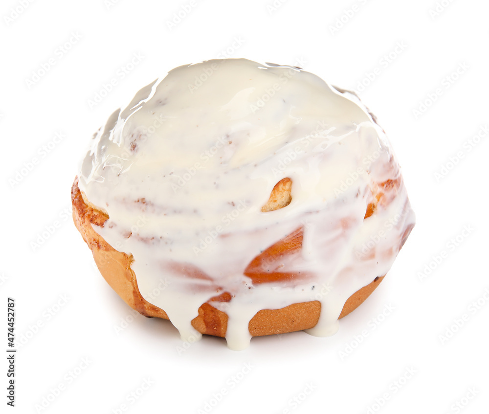 Tasty cinnamon roll with cream on white background