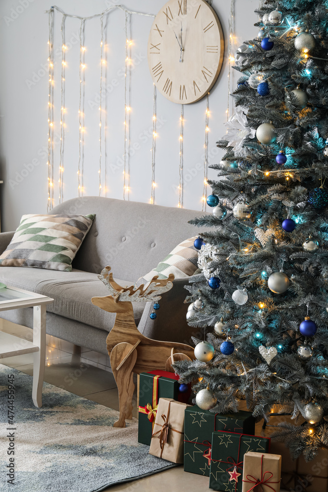 Stylish interior of living room with Christmas tree