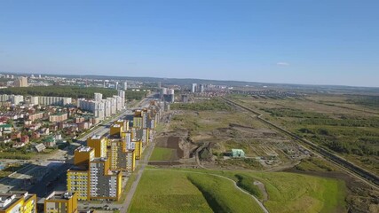 Wall Mural - New buildings in a new area of the city of Ekaterinburg. Construction of houses, parks and roads. Russia, Aerial View Hyperlapse