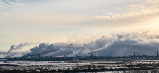 The destructive effect on the nature and human health of toxic emissions from heavy industry. Ecological concept.