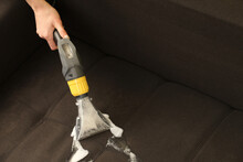 Deep professional cleaning of sofa with vaccum cleaner