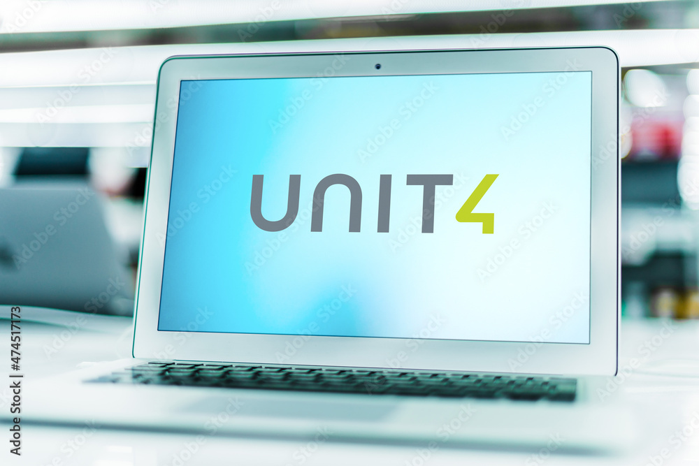 Laptop computer displaying logo of Unit4 Stock Photo | Adobe Stock