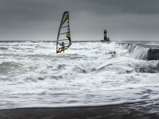 Wall Mural - alone wind surfer in waves in storm weather on Black sea in Ukraine