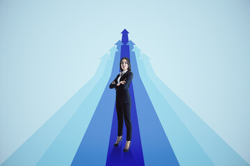 Wall Mural - Attractive young european businesswoman with blue arrows on light background. Way, direction and success concept.