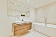 © Casa imágenes - Luxurious bathroom with a beautiful hanging wooden chest of drawers with a sink