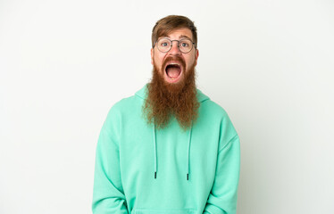 Young reddish caucasian man isolated on white background with surprise facial expression