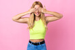 © luismolinero - Young Uruguayan blonde woman over isolated pink background covering eyes by hands and smiling