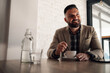 © Zamrznuti tonovi - Handsome businessman drinking coffee in a cafe