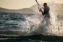 Woman Kitesurfer Athlete Splashes On Sea Waves
