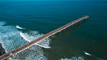 High Angle Drone View Of St Augustine Villano Beach Fishing Pier Off The East Coast Of Florida With Turquoise Atlantic Ocean Waves And Foam