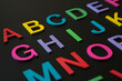 © chalongrat - Colorful wooden english letters A-Z on black background