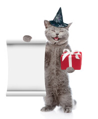 Poster - Happy cat wearing hat for halloween holds empty list and gift box. isolated on white background