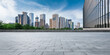 © ABCDstock - Panoramic skyline and modern commercial office buildings with empty road. empty square floors and cityscape.