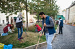 © Halfpoint - Young man volunteer with team cleaning up street, community service concept