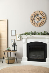 Sticker - Stylish room decorated with beautiful eucalyptus garland on fireplace