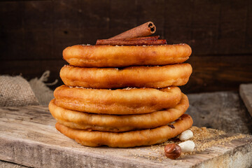 Wall Mural - A stack of stuffed fried dough. Korean street food hotteok.