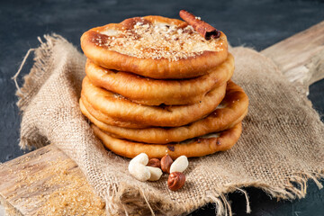 Wall Mural - Korean street food. Hotteok fried dough with sweet filling.