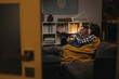 © cherryandbees - middle age couple relaxing at home watching tv